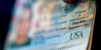 A close up of a passport showing a gender marker