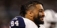 Marshawn Kneeland of the Dallas Cowboys looks on from the sideline in 2024.
