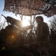 Ukrainian servicemen prepare to fire a self-propelled howitzer towards Russian troopsn near the front line town of Pokrovsk